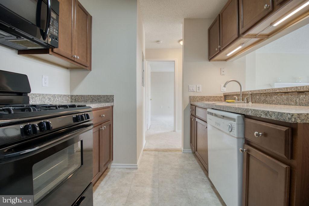 21024 Timber Ridge Terrace, Unit 303 Ashburn, VA 20147 - Photo 11 of 42 Hallway Off Kitchen