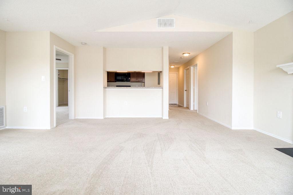 21024 Timber Ridge Terrace, Unit 303 Ashburn, VA 20147 - Photo 14 of 42 Living Room View To Kitchen