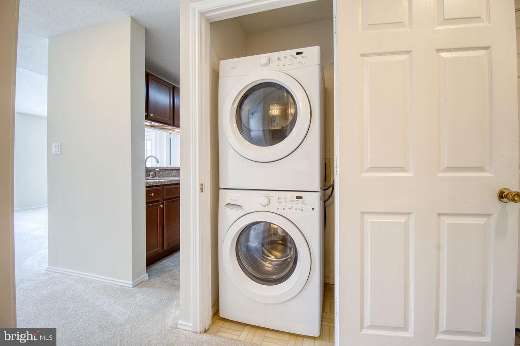 21024 Timber Ridge Terrace, Unit 303 Ashburn, VA 20147 - Photo 16 of 42 Washer And Dryer Just Off The Kitchen