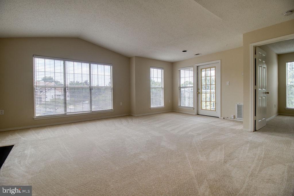 21024 Timber Ridge Terrace, Unit 303 Ashburn, VA 20147 - Photo 19 of 42 French Door Leads To Balcony From Living Room