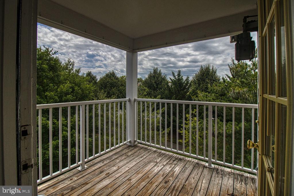 21024 Timber Ridge Terrace, Unit 303 Ashburn, VA 20147 - Photo 20 of 42 Private Covered Balcony With View Of Trees
