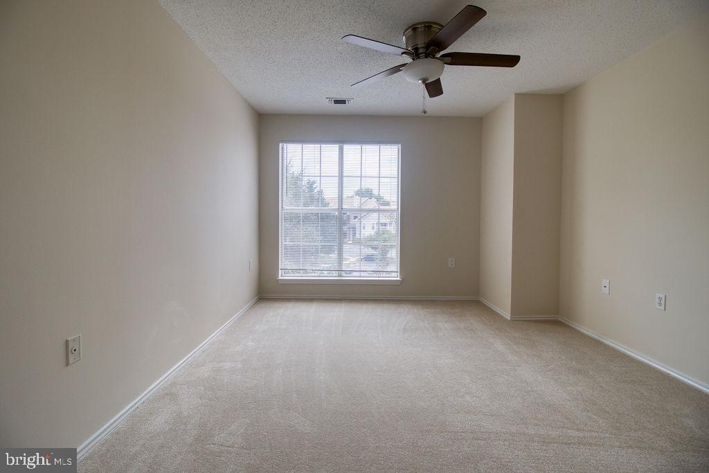 21024 Timber Ridge Terrace, Unit 303 Ashburn, VA 20147 - Photo 24 of 42 Large Window In Secondary Bedroom New Ceiling Fan