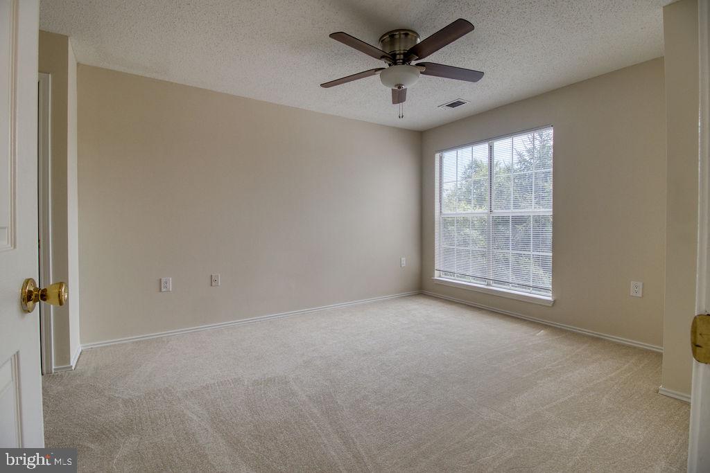21024 Timber Ridge Terrace, Unit 303 Ashburn, VA 20147 - Photo 26 of 42 Master Bedroom With New Ceiling Fan