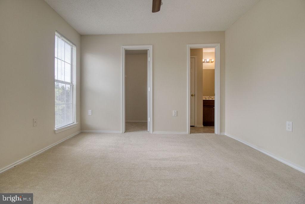 21024 Timber Ridge Terrace, Unit 303 Ashburn, VA 20147 - Photo 28 of 42 Master Bedroom With Attached Full Bathroom