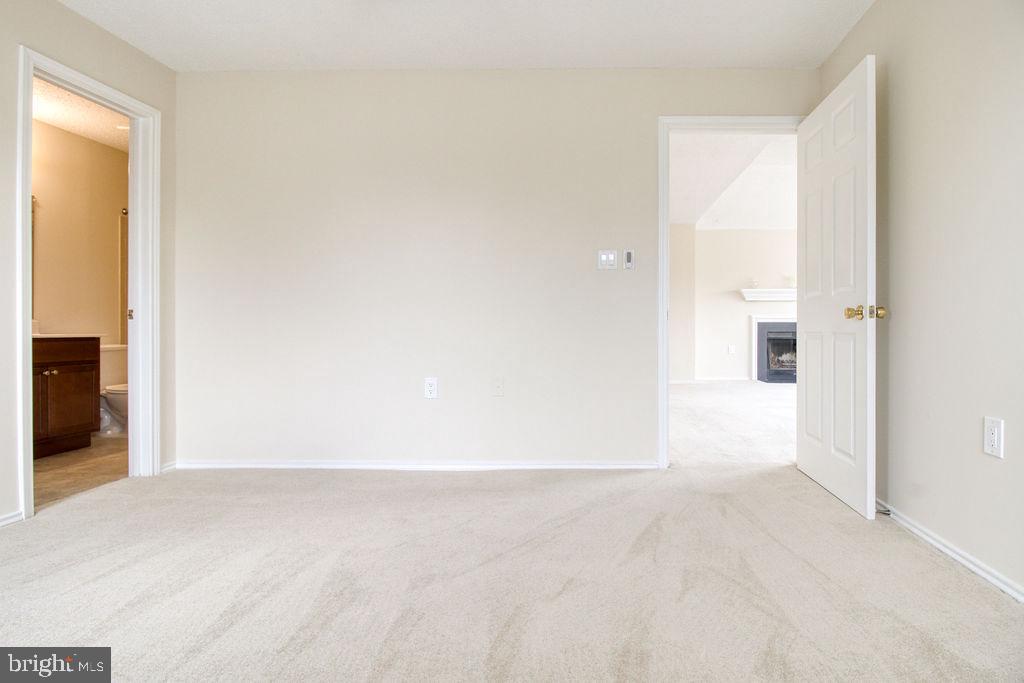 21024 Timber Ridge Terrace, Unit 303 Ashburn, VA 20147 - Photo 29 of 42 View To Living Room From Master Bedroom