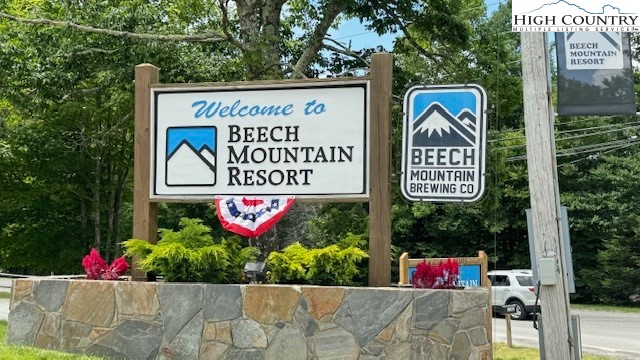907 Charter Hills Road Beech Mountain, NC 28604 - Photo 17 of 17 a street sign on a pole on a street