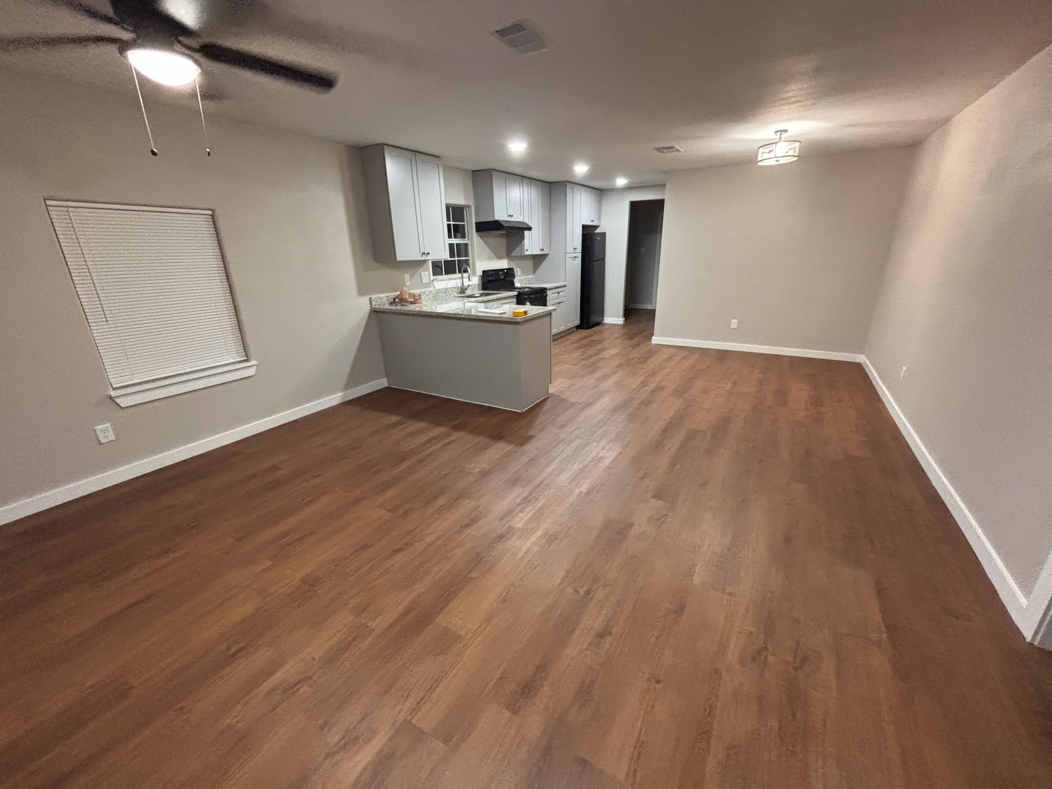 8546 Talton Street Houston, TX 77028 - Photo 3 of 8 a view of kitchen with wooden floor