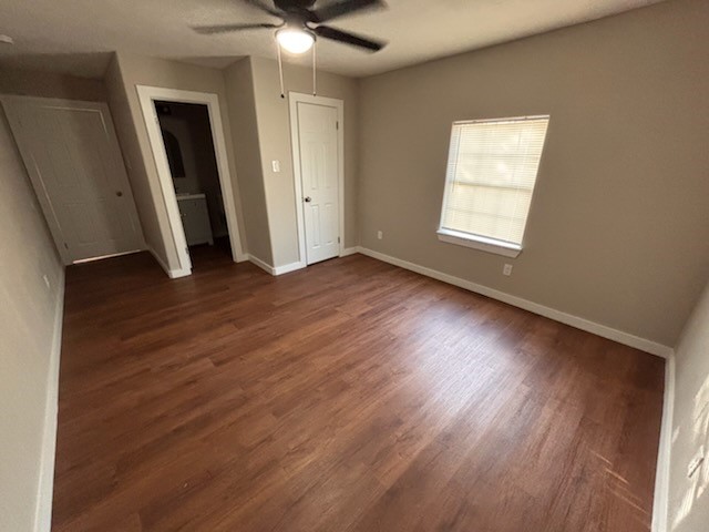 8546 Talton Street Houston, TX 77028 - Photo 8 of 8 an empty room with wooden floor and windows