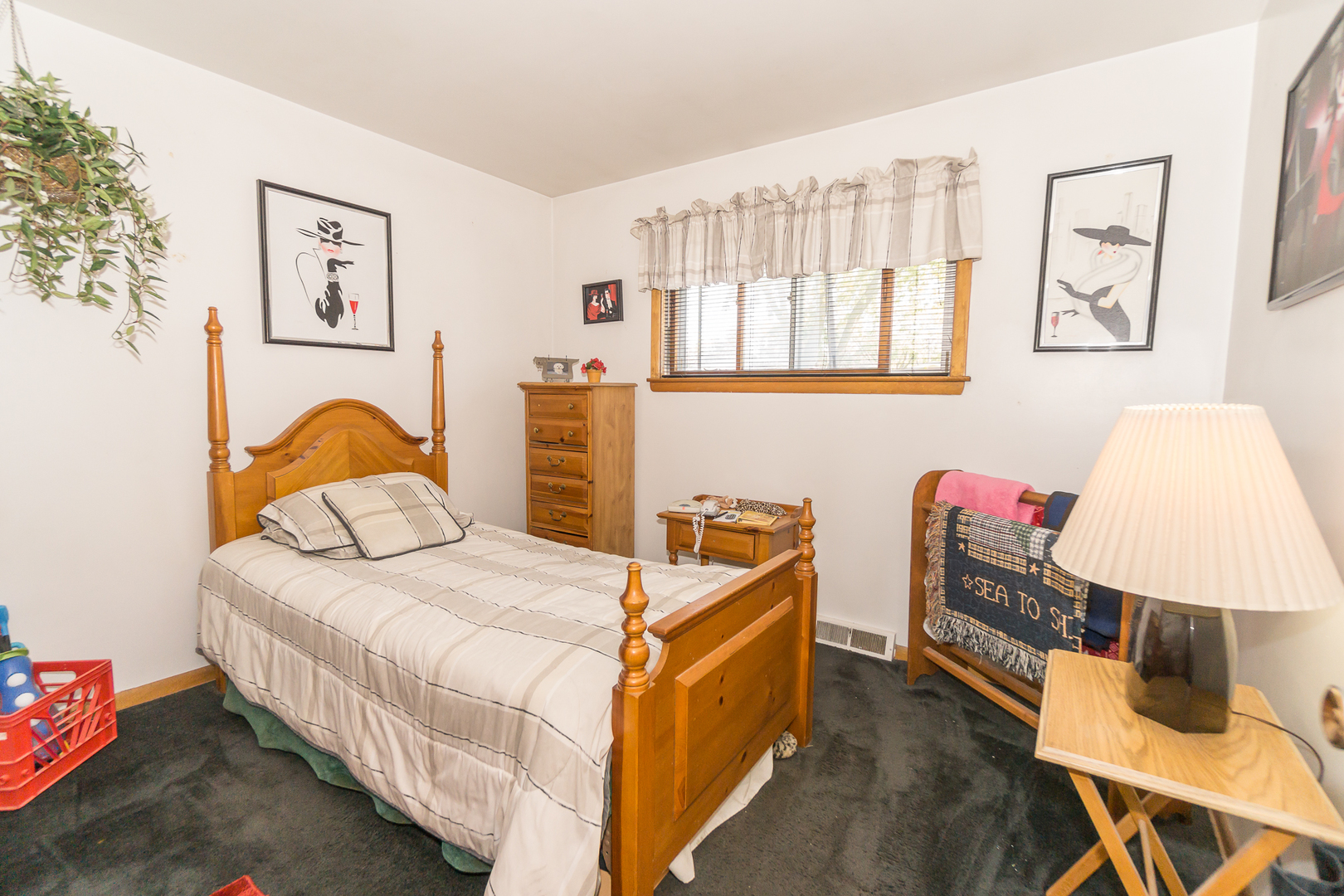 78 Evergreen Street Addison, IL 60101 - Photo 11 of 16 a bedroom with a bed and a lamp