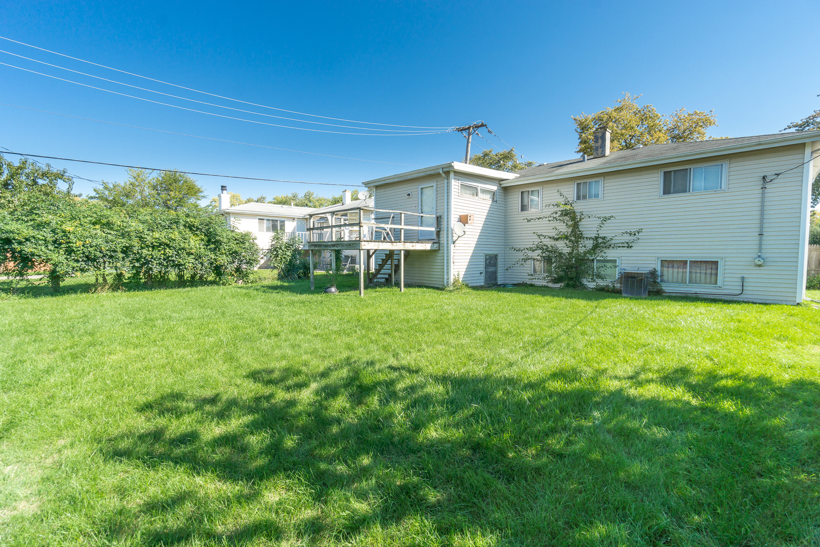 78 Evergreen Street Addison, IL 60101 - Photo 15 of 16 a view of a house with a yard