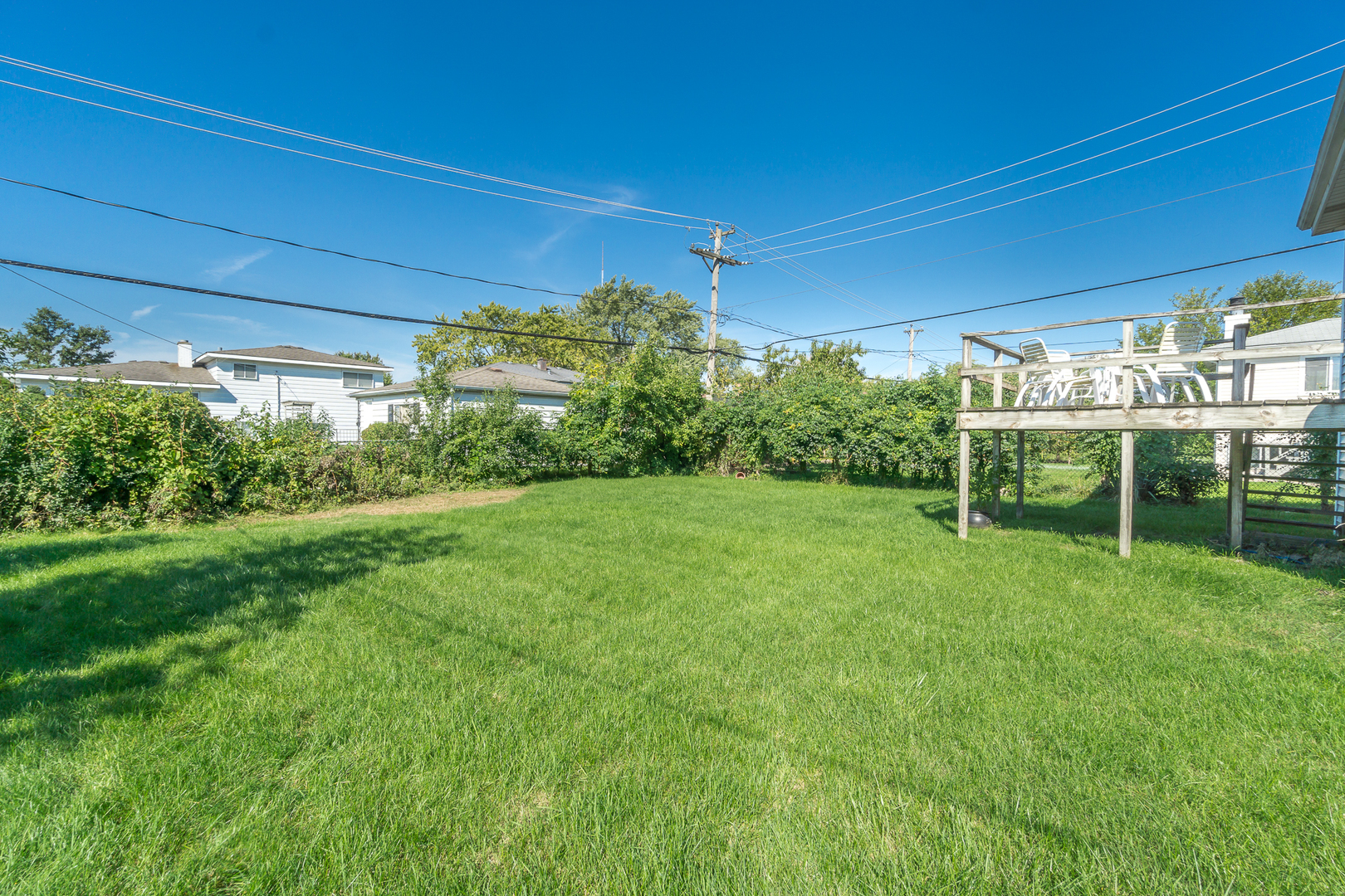 78 Evergreen Street Addison, IL 60101 - Photo 16 of 16 a view of a chair and table in backyard