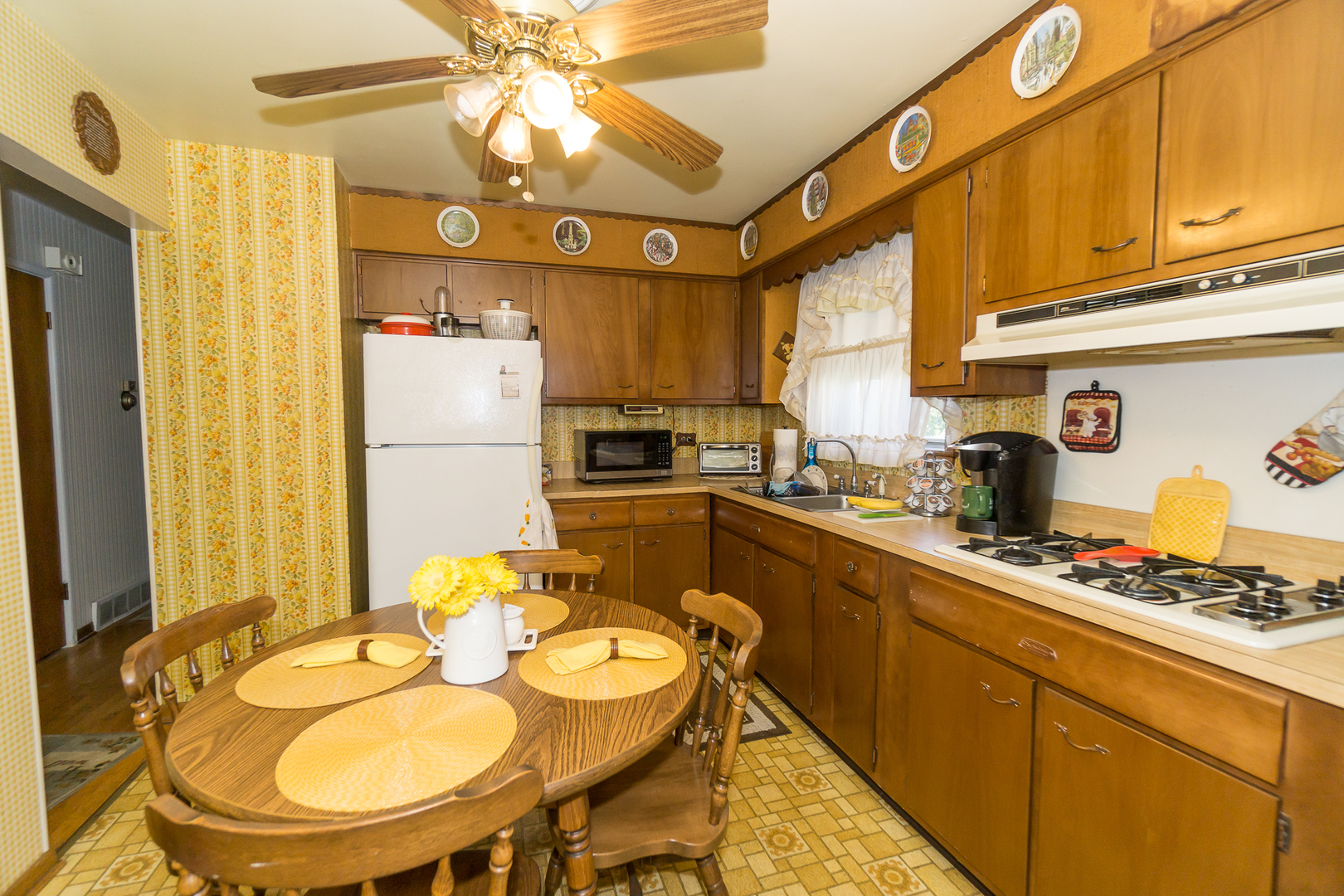 78 Evergreen Street Addison, IL 60101 - Photo 7 of 16 a kitchen with stainless steel appliances granite countertop a sink a stove and a refrigerator