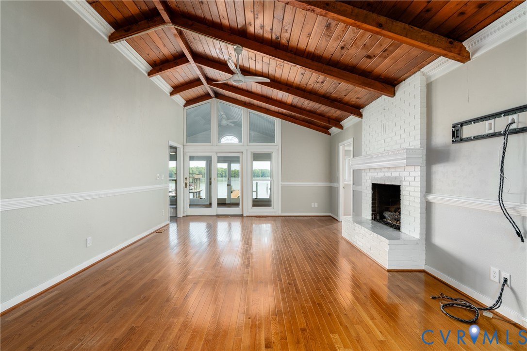3032 North Riverside Drive Lanexa, VA 23089 - Photo 24 of 33 Spacious room featuring vaulted wood-paneled ceili