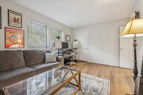 a living room with furniture and a window