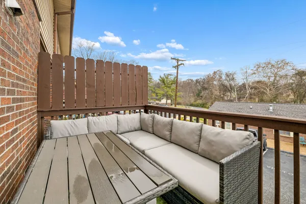 a view of balcony with furniture