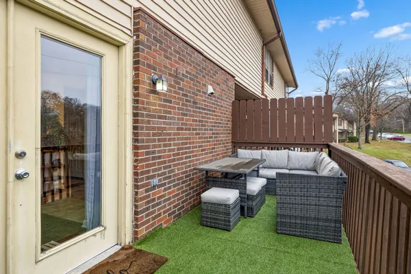 a view of outdoor sitting area with furniture and garden