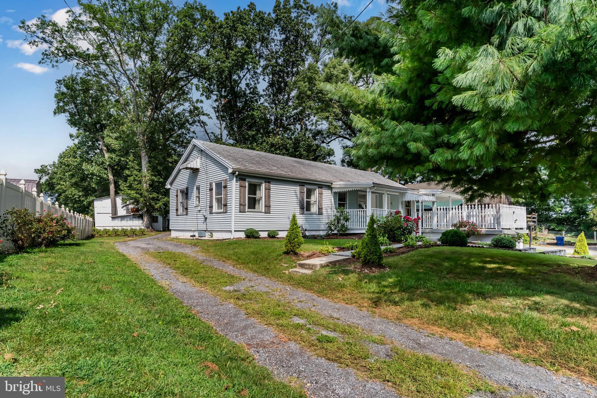 2103 Smoketown Road Fayetteville, PA 17222 - Photo 1 of 28 a front view of a house with garden