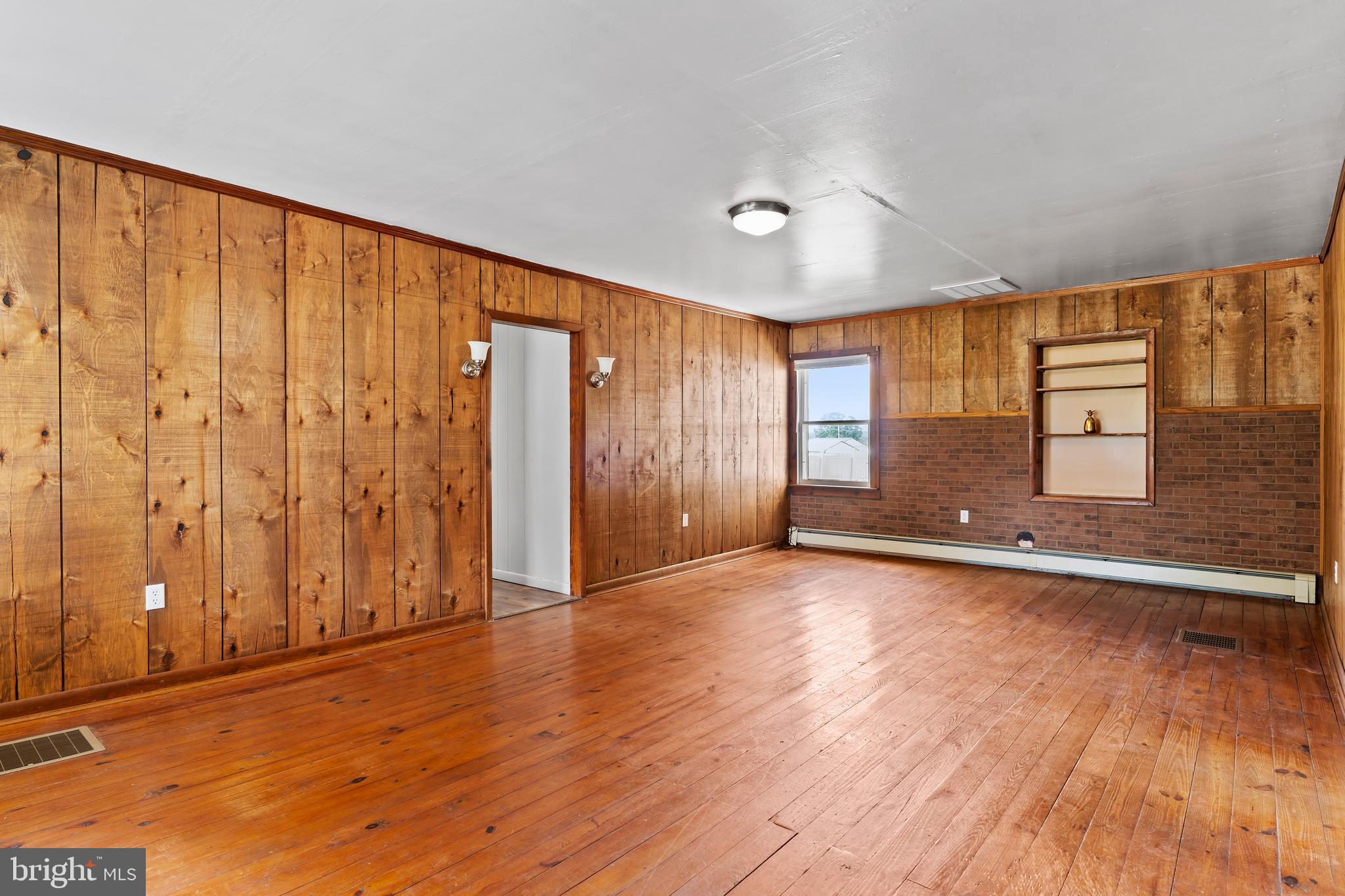 2103 Smoketown Road Fayetteville, PA 17222 - Photo 11 of 28 an empty room with wooden floor and windows