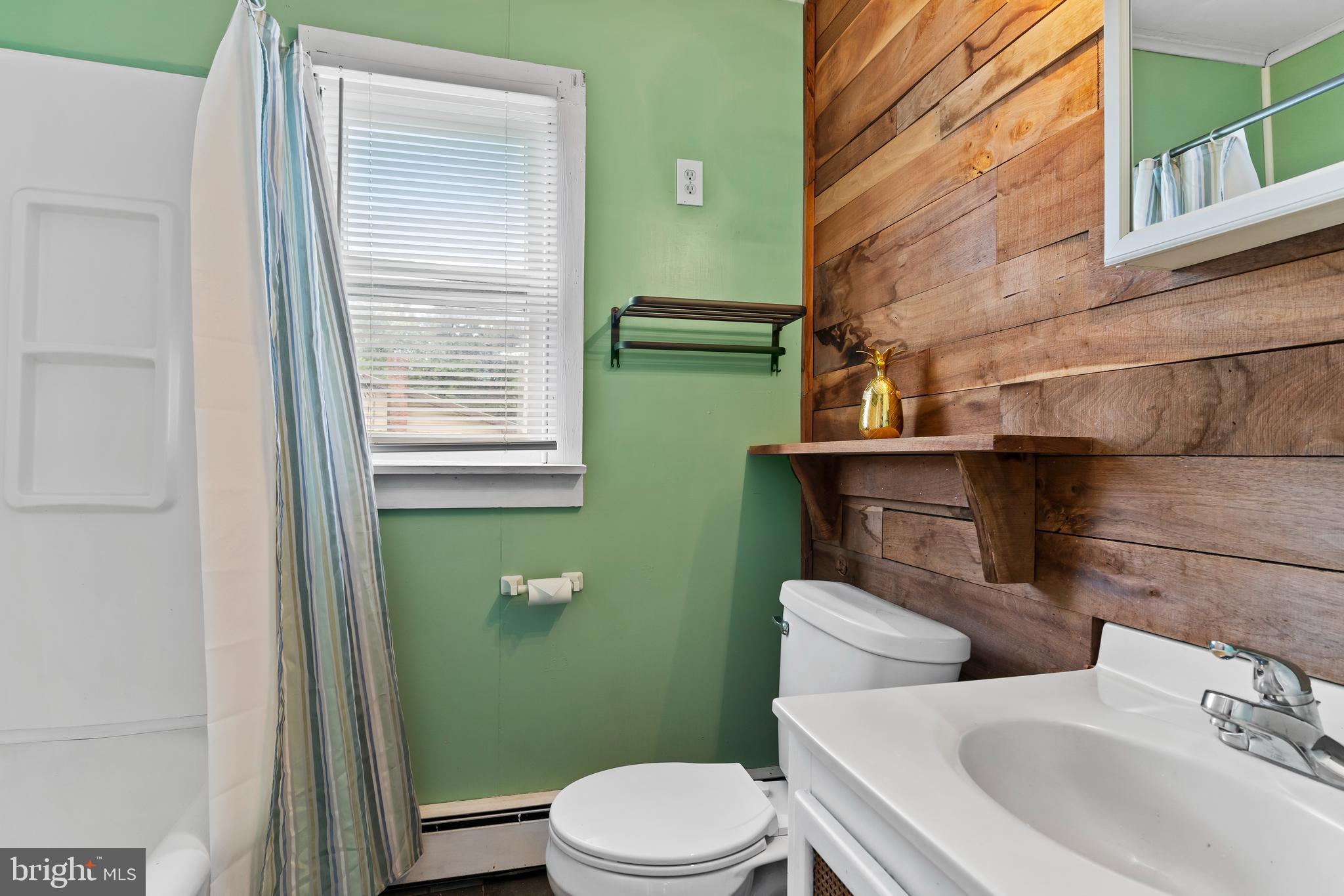 2103 Smoketown Road Fayetteville, PA 17222 - Photo 14 of 28 a bathroom with a sink a toilet and mirror