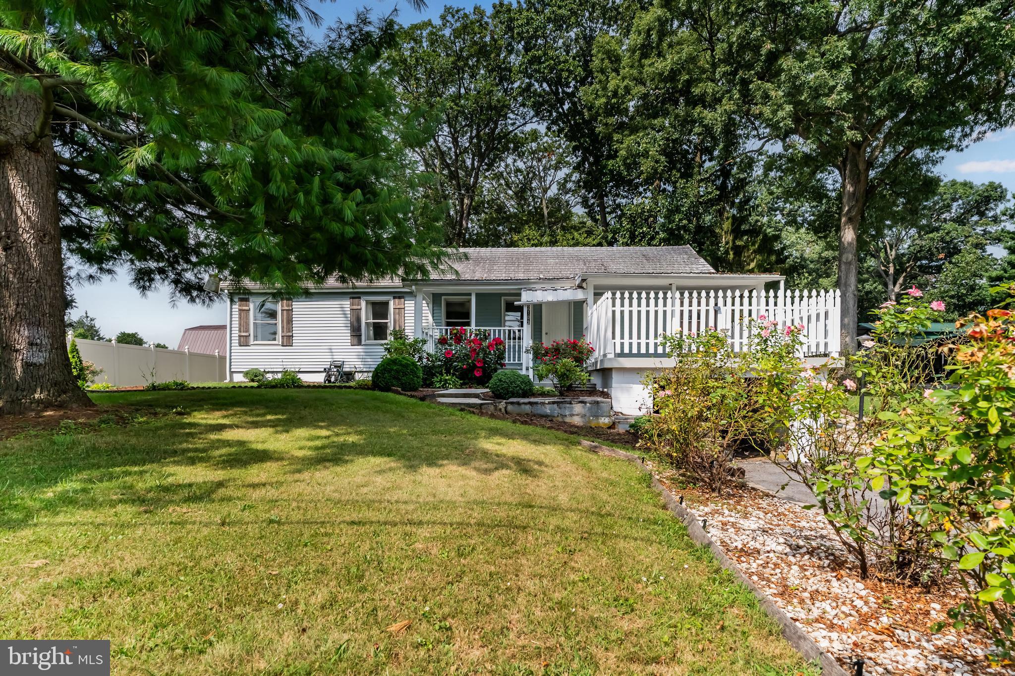 2103 Smoketown Road Fayetteville, PA 17222 - Photo 2 of 28 a front view of a house with a yard and porch