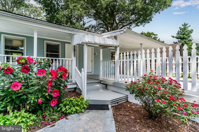 a view of a house with flower garden