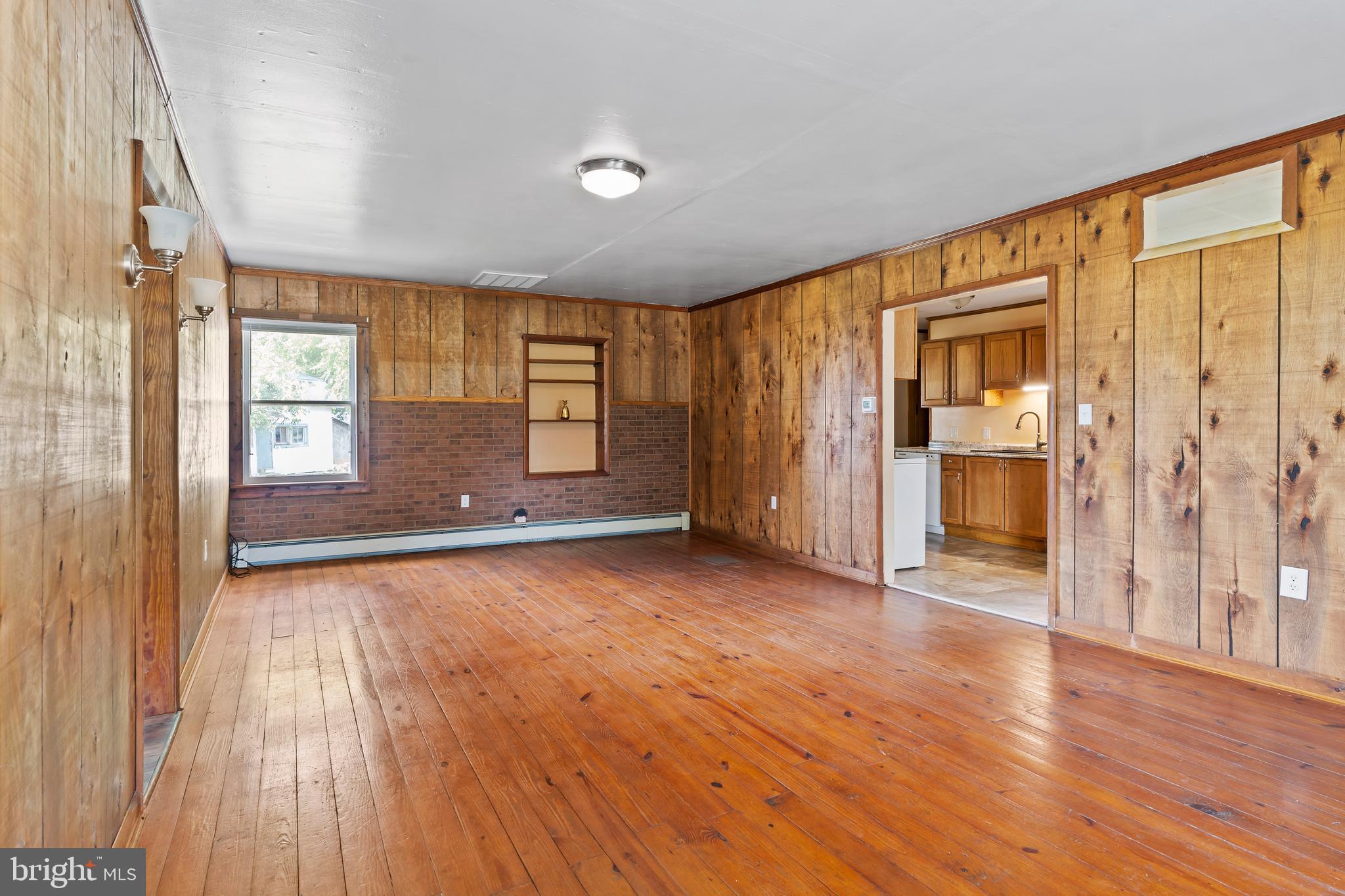 2103 Smoketown Road Fayetteville, PA 17222 - Photo 6 of 28 an empty room with wooden floor and windows