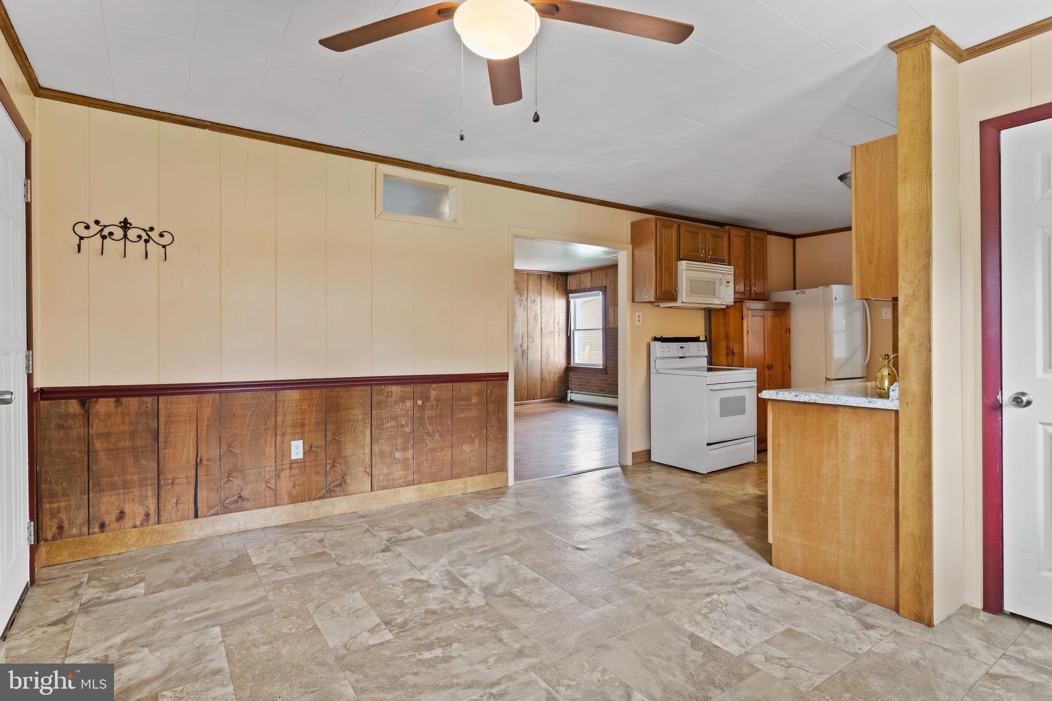 2103 Smoketown Road Fayetteville, PA 17222 - Photo 7 of 28 a view of a kitchen with a refrigerator a stove top oven and a refrigerator