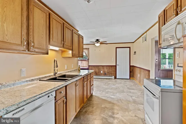 a kitchen that has a sink and a stove