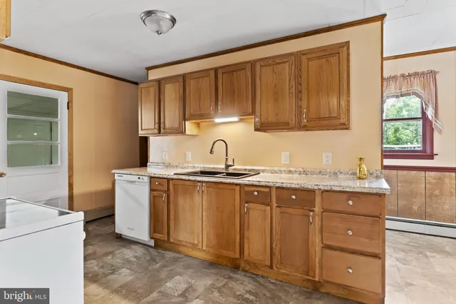 a kitchen with a sink and cabinets