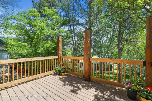 a kitchen with a refrigerator and a sink