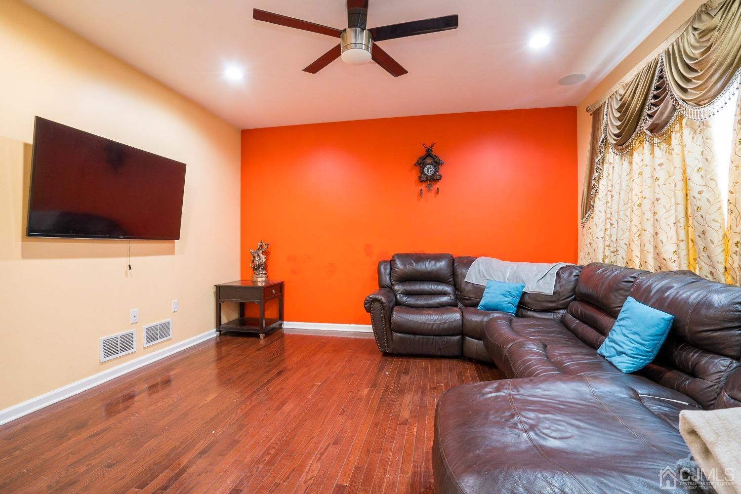 8 Maxwell Road Monroe Township, NJ 08831 - Photo 12 of 40 a living room with furniture and a flat screen tv