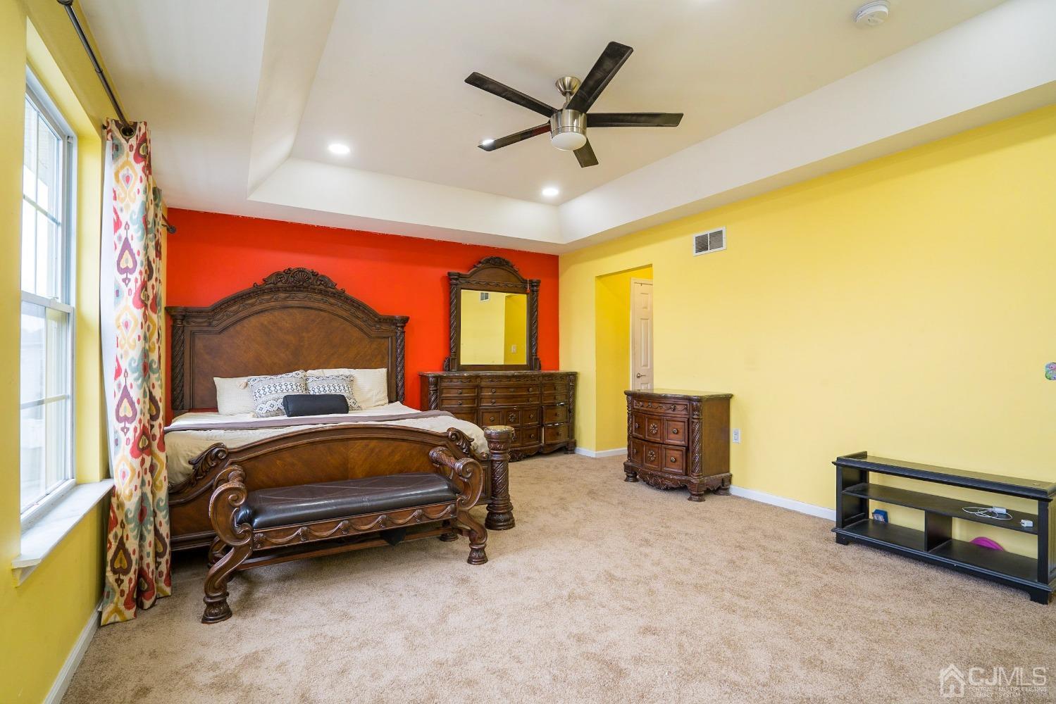 8 Maxwell Road Monroe Township, NJ 08831 - Photo 14 of 40 a bedroom with a bed and a chandelier