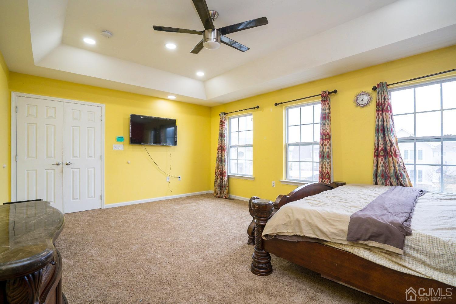 8 Maxwell Road Monroe Township, NJ 08831 - Photo 15 of 40 a bedroom with a bed and wooden floor