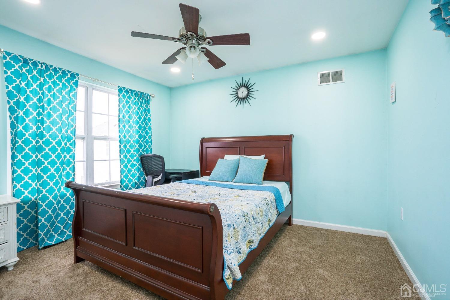 8 Maxwell Road Monroe Township, NJ 08831 - Photo 19 of 40 a bedroom with a large bed and a window