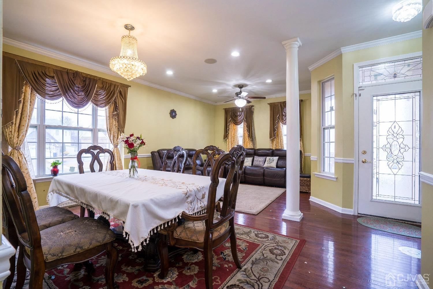 8 Maxwell Road Monroe Township, NJ 08831 - Photo 2 of 40 a view of a dining room with furniture window and wooden floor