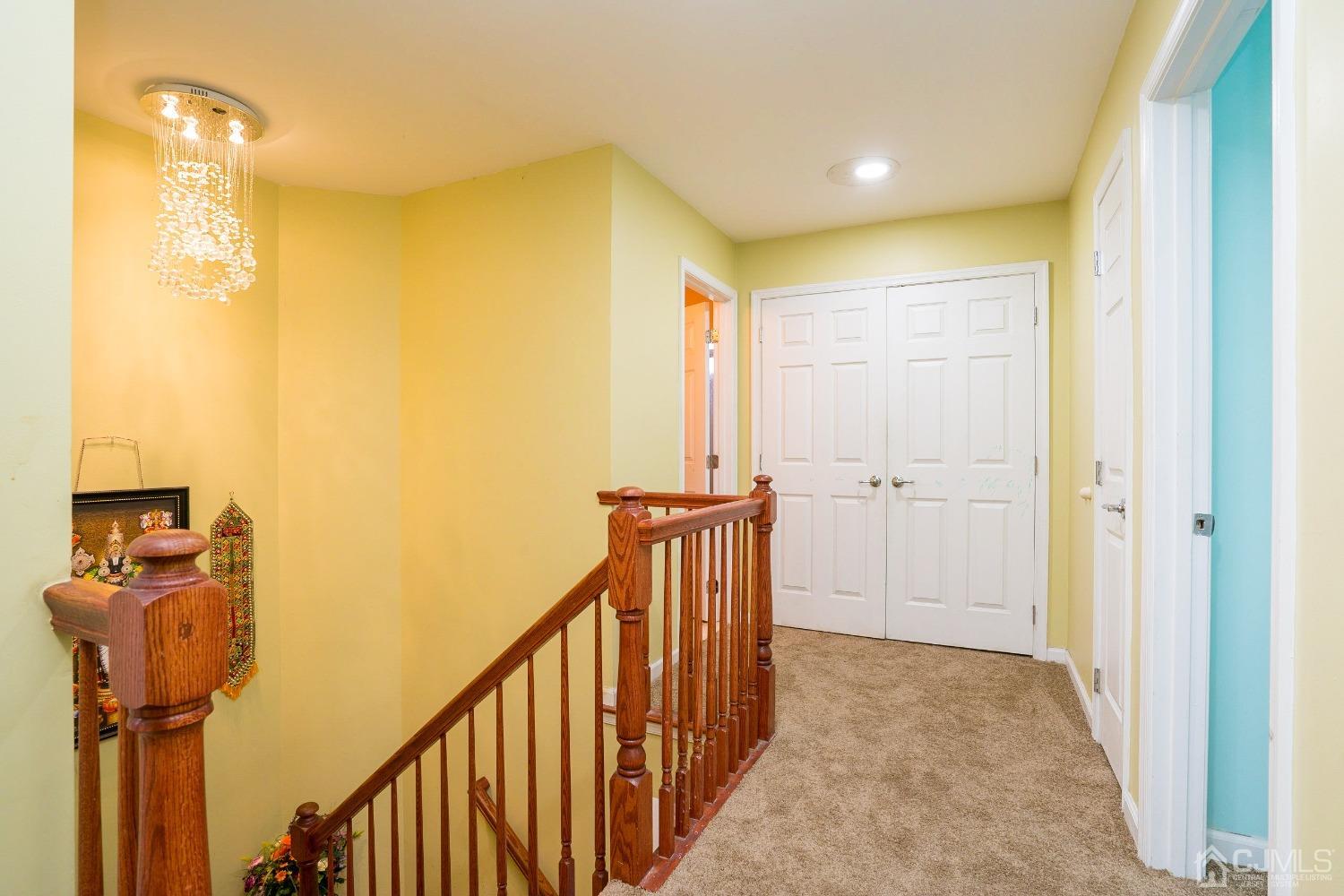 8 Maxwell Road Monroe Township, NJ 08831 - Photo 28 of 40 a view of a hallway with a yellow & door