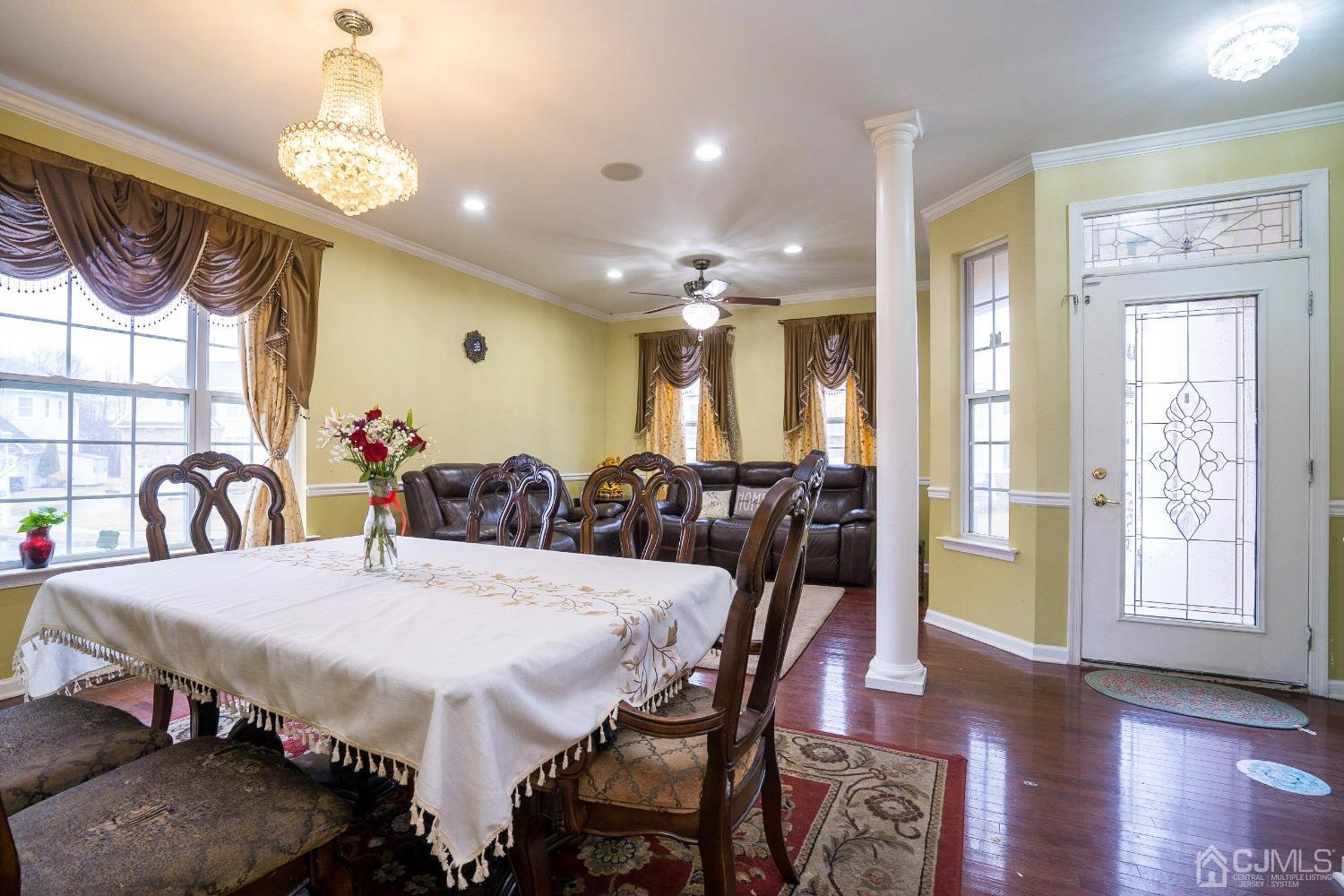 8 Maxwell Road Monroe Township, NJ 08831 - Photo 3 of 40 a view of a dining room with furniture window and wooden floor