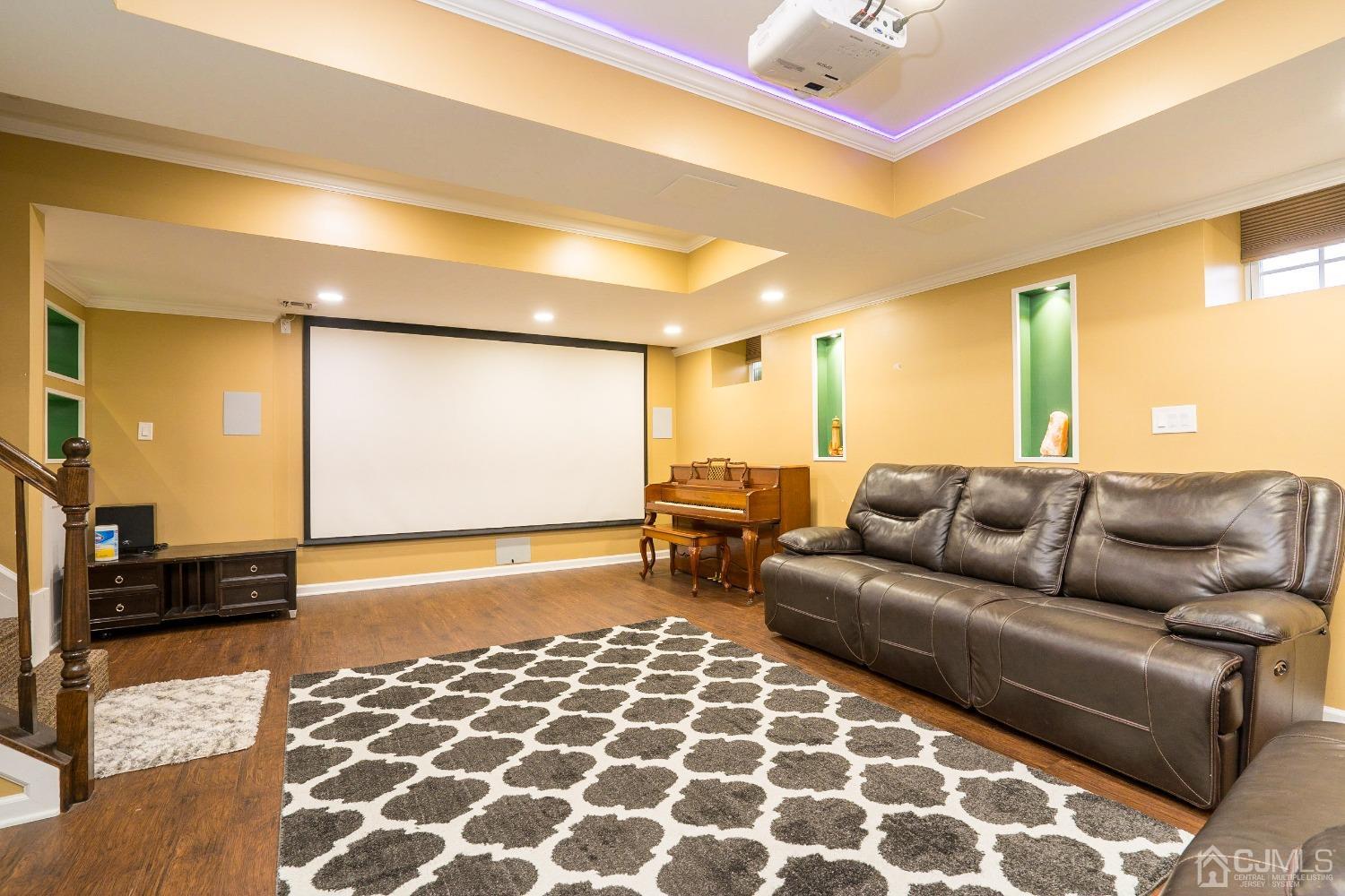 8 Maxwell Road Monroe Township, NJ 08831 - Photo 32 of 40 a living room with furniture and a flat screen tv