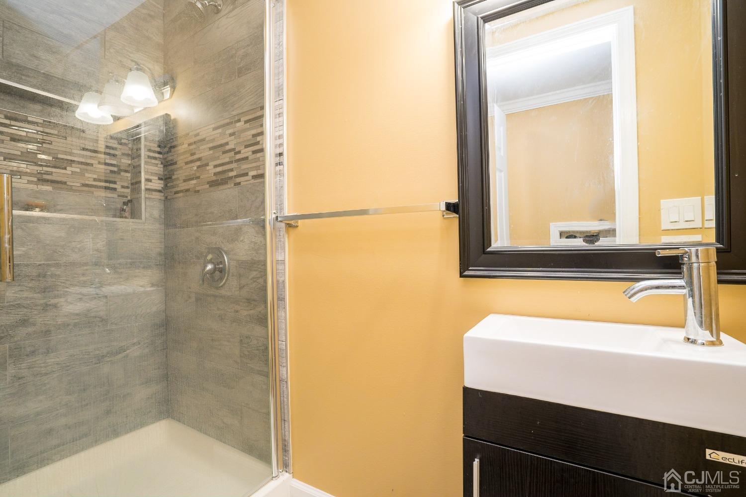 8 Maxwell Road Monroe Township, NJ 08831 - Photo 33 of 40 a bathroom with a bathtub and a shower