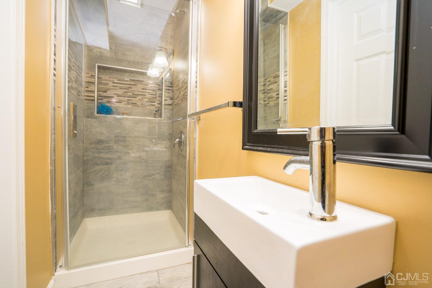 8 Maxwell Road Monroe Township, NJ 08831 - Photo 34 of 40 a bathroom with a sink and a bathtub