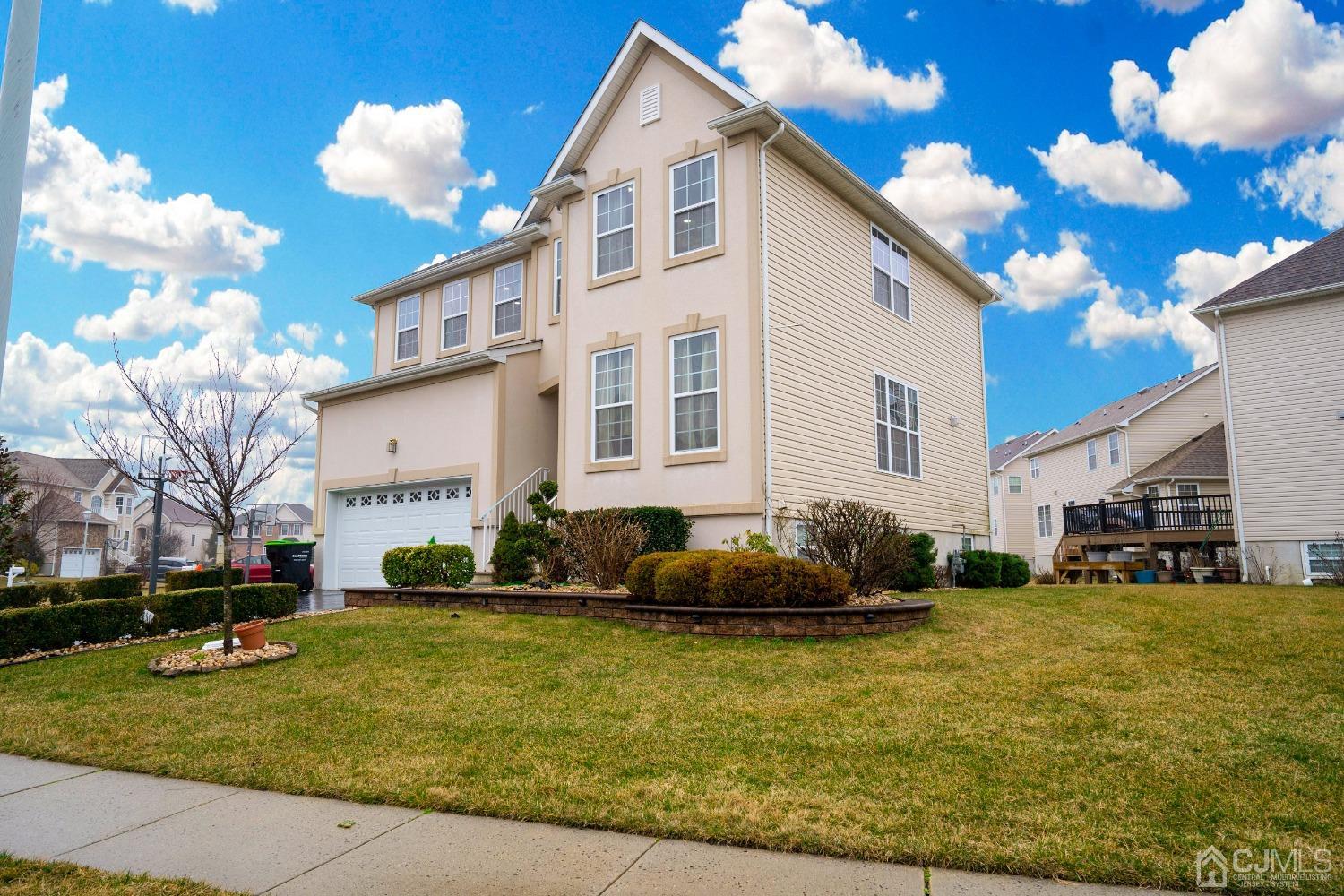 8 Maxwell Road Monroe Township, NJ 08831 - Photo 38 of 40 a front view of a house with garden