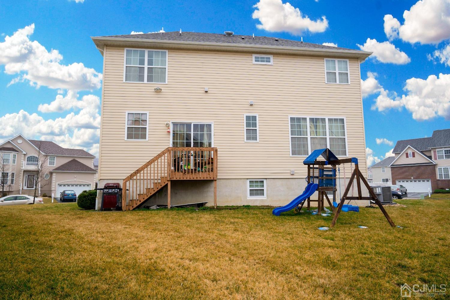 8 Maxwell Road Monroe Township, NJ 08831 - Photo 40 of 40 a view of a house with a backyard and a table
