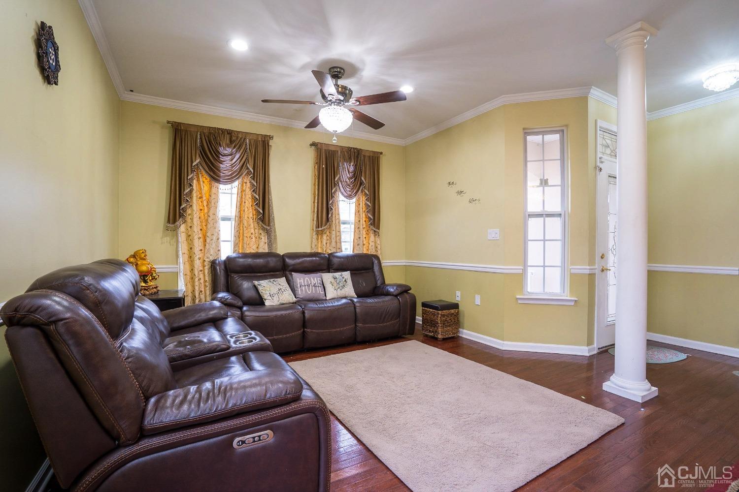 8 Maxwell Road Monroe Township, NJ 08831 - Photo 6 of 40 a living room with furniture and a chandelier