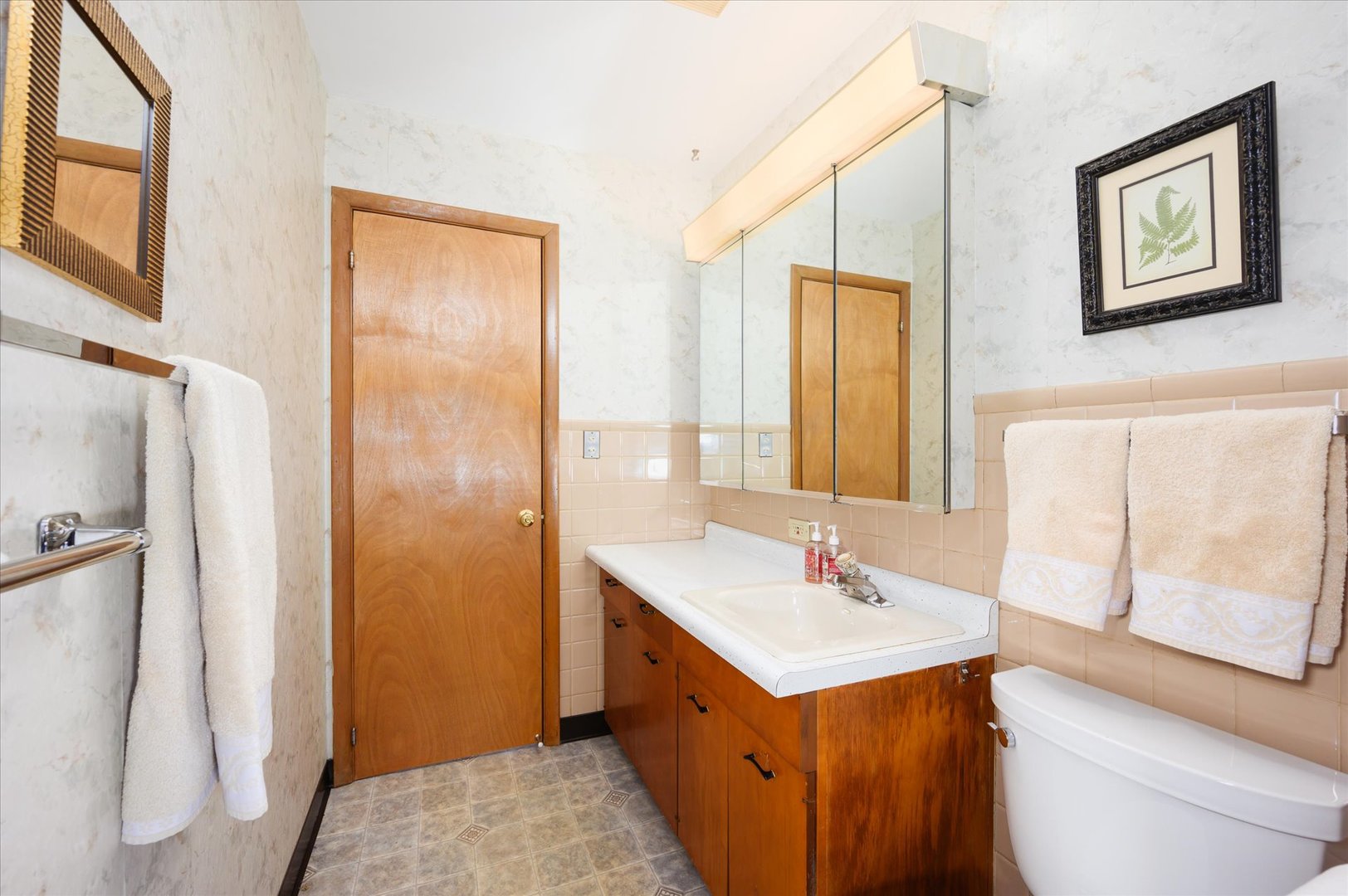 366 Lance Drive Des Plaines, IL 60016 - Photo 13 of 33 a bathroom with a double vanity sink toilet and mirror