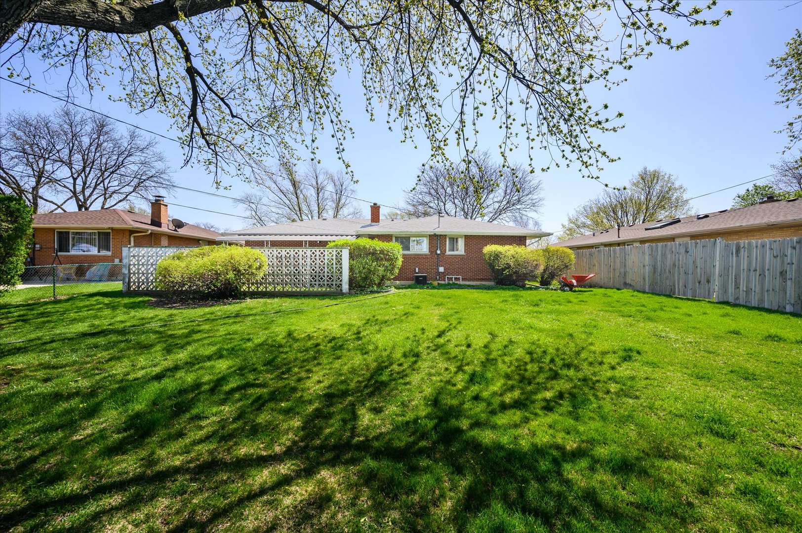 366 Lance Drive Des Plaines, IL 60016 - Photo 30 of 33 a front view of a house with garden and yard