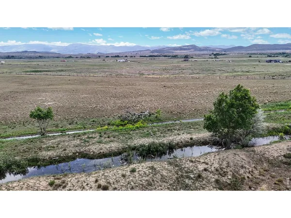a view of a lake with a yard
