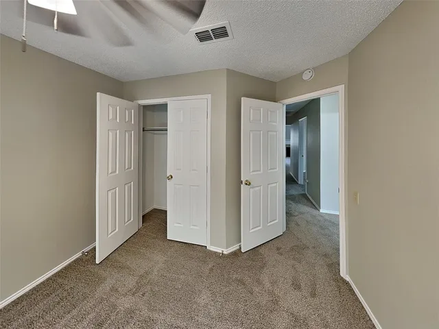 an empty room with a bathroom