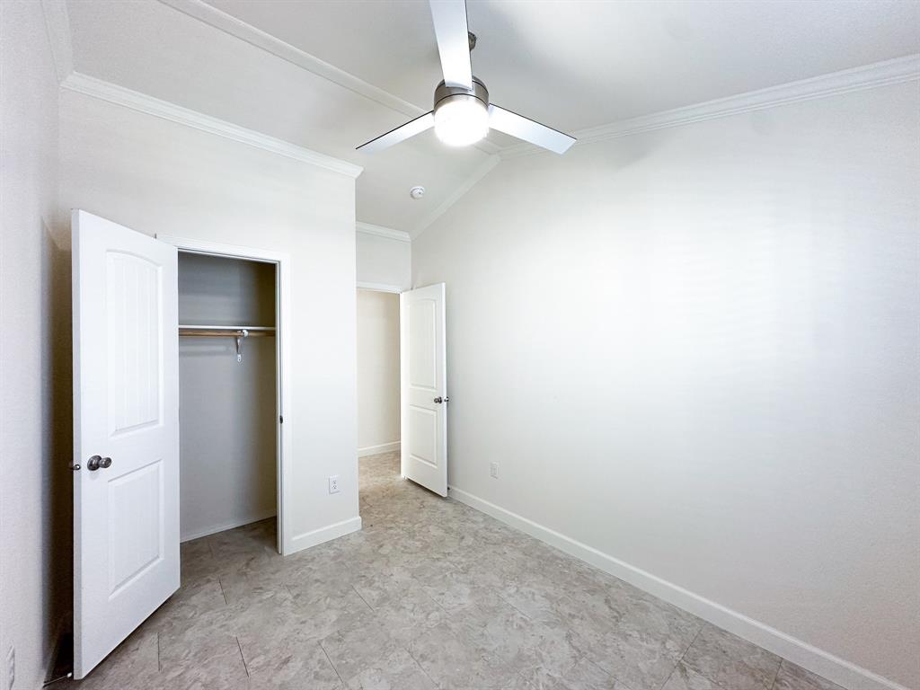 153 Cabrera Street Oak Point, TX 75068 - Photo 8 of 22 Room featuring a ceiling fan with integrated lighting, crown molding, and neutral wall paint