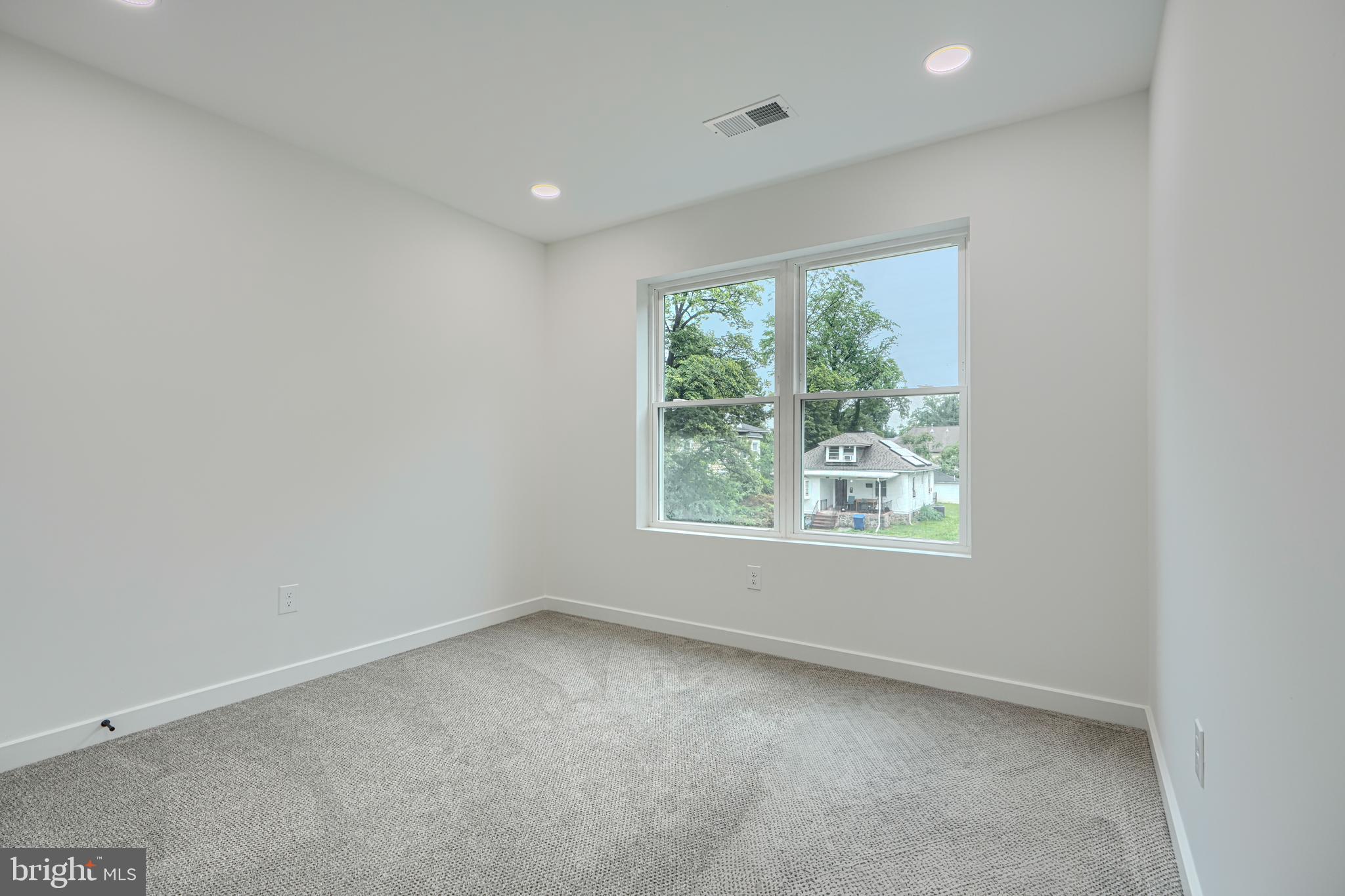 3410 Pinkney Road Baltimore, MD 21215 - Photo 25 of 55 an empty room with windows