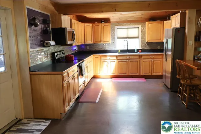 a kitchen with counter top space and a window